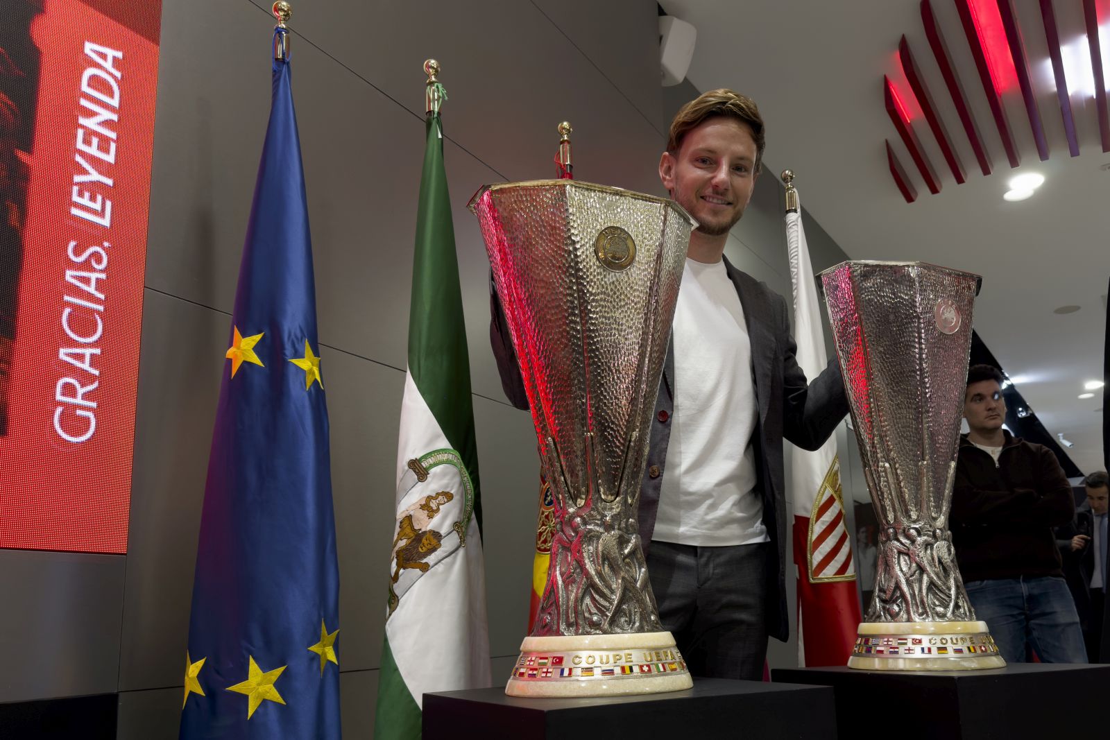 epa11114201 Croatian midfielder Ivan Rakitic poses next to Europa League trophies during his farewell press conference in Seville, Spain, 30 January 2024. Rakitic leaves Sevilla FC after 323 official soccer matches over to terms, 2011 to 2014 and 2020 to 2024, to join Saudi Pro League club Al-Shabab.  EPA/David Arjona