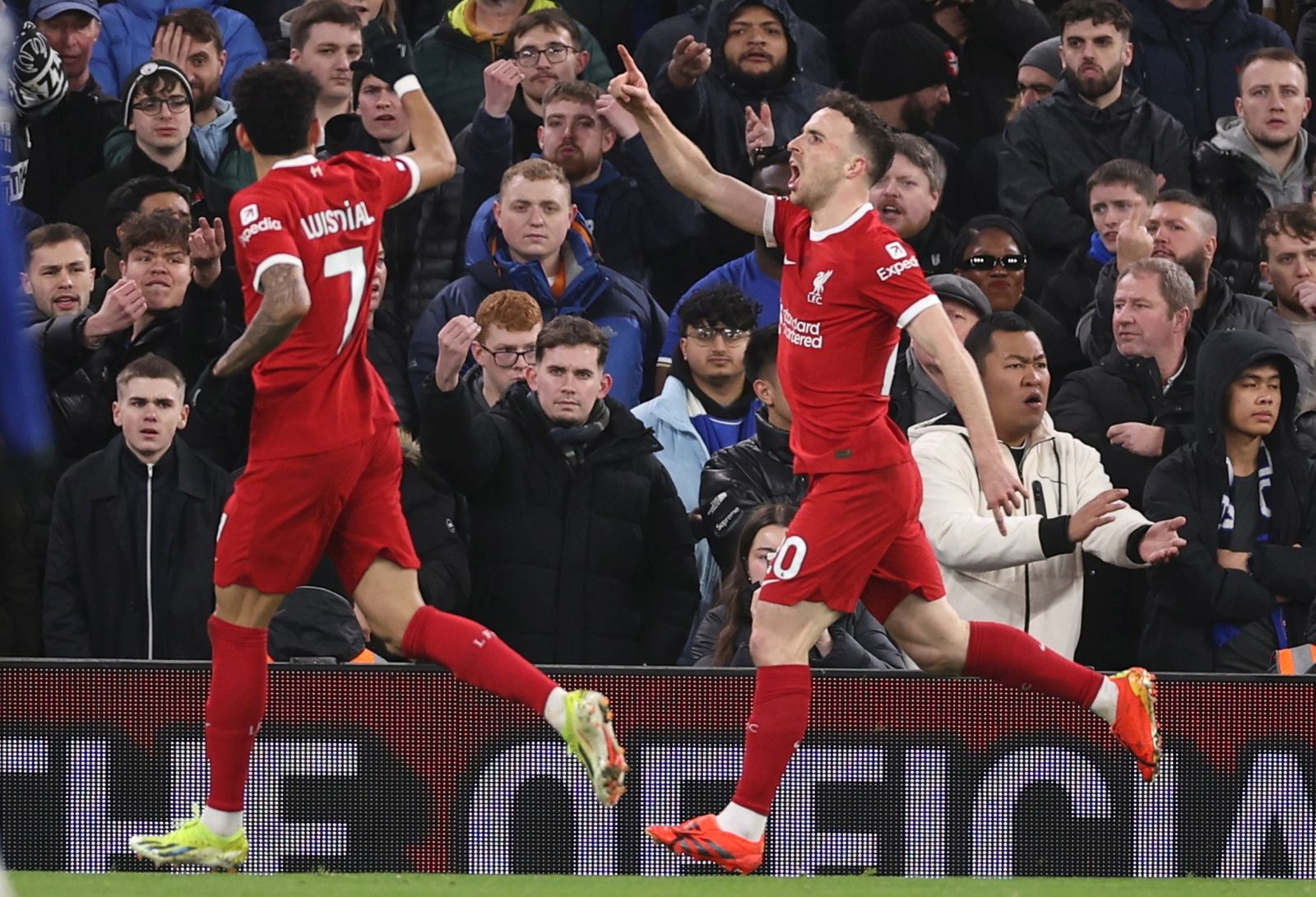epa11116714 Liverpool's Diogo Jota celebrates with teammates after scoring the 1-0 lead during the English Premier League soccer match between Liverpool FC and Chelsea FC, in Liverpool, Britain, 31 January 2024.  EPA/ADAM VAUGHAN EDITORIAL USE ONLY. No use with unauthorized audio, video, data, fixture lists, club/league logos, 'live' services or NFTs. Online in-match use limited to 120 images, no video emulation. No use in betting, games or single club/league/player publications.