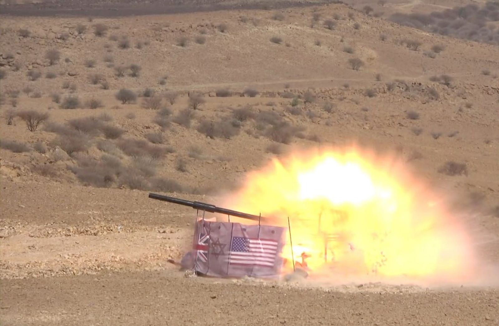 epa11124156 A handout photo made available by the Houthis media center shows an explosion in a mock position marked with US and Israeli flags during a military exercise at a remote area on the outskirts of Sana'a, Yemen, 03 February 2024. Yemen's Houthi forces have carried out a military exercise on mock US and Israeli positions as part of their preparations for a possible confrontation with the United States and Israel amid fears of a wider regional conflict stemming from the Houthi escalation of attacks on shipping lanes in the Red Sea and the Gulf of Aden. US and British forces have conducted strikes in response to Houthi missile and drone attacks on military and commercial vessels in the Red Sea, the Bab al-Mandab Strait, and the Gulf of Aden since November 2023. In January 2024, the US Department of State designated Yemen's Houthis as a 'Specially Designated Global Terrorist group' due to their increased attacks on shipping lanes. In December 2023, the US Department of Defense announced a multinational operation to safeguard trade and protect ships in the Red Sea in response to the escalation of Houthi attacks.  EPA/HOUTHIS MEDIA CENTER HANDOUT  HANDOUT EDITORIAL USE ONLY/NO SALES HANDOUT EDITORIAL USE ONLY/NO SALES