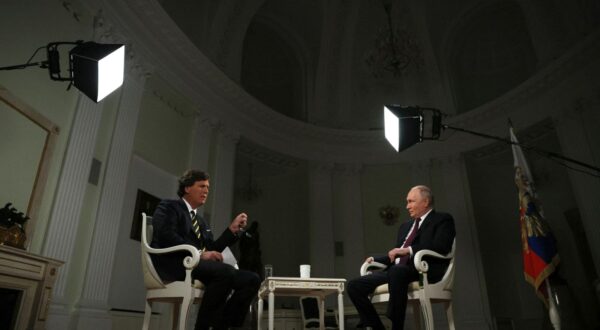 epa11138505 Russian President Vladimir Putin (R) attends an interview with US journalist Tucker Carlson at the Kremlin in Moscow, Russia, 09 February 2024.  EPA/GAVRIIL GRIGOROV/SPUTNIK/KREMLIN POOL MANDATORY CREDIT