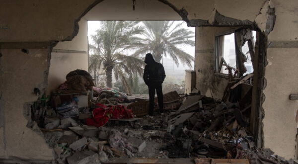 epa11138545 A Palestinian inspects a damaged building following an Israeli airstrike on the Rafah refugee camp, southern Gaza Strip, 09 February 2024. More than 27,500 Palestinians and over 1,300 Israelis have been killed, according to the Palestinian Health Ministry and the Israel Defense Forces (IDF), since Hamas militants launched an attack against Israel from the Gaza Strip on 07 October 2023, and the Israeli operations in Gaza and the West Bank which followed it.  EPA/HAITHAM IMAD