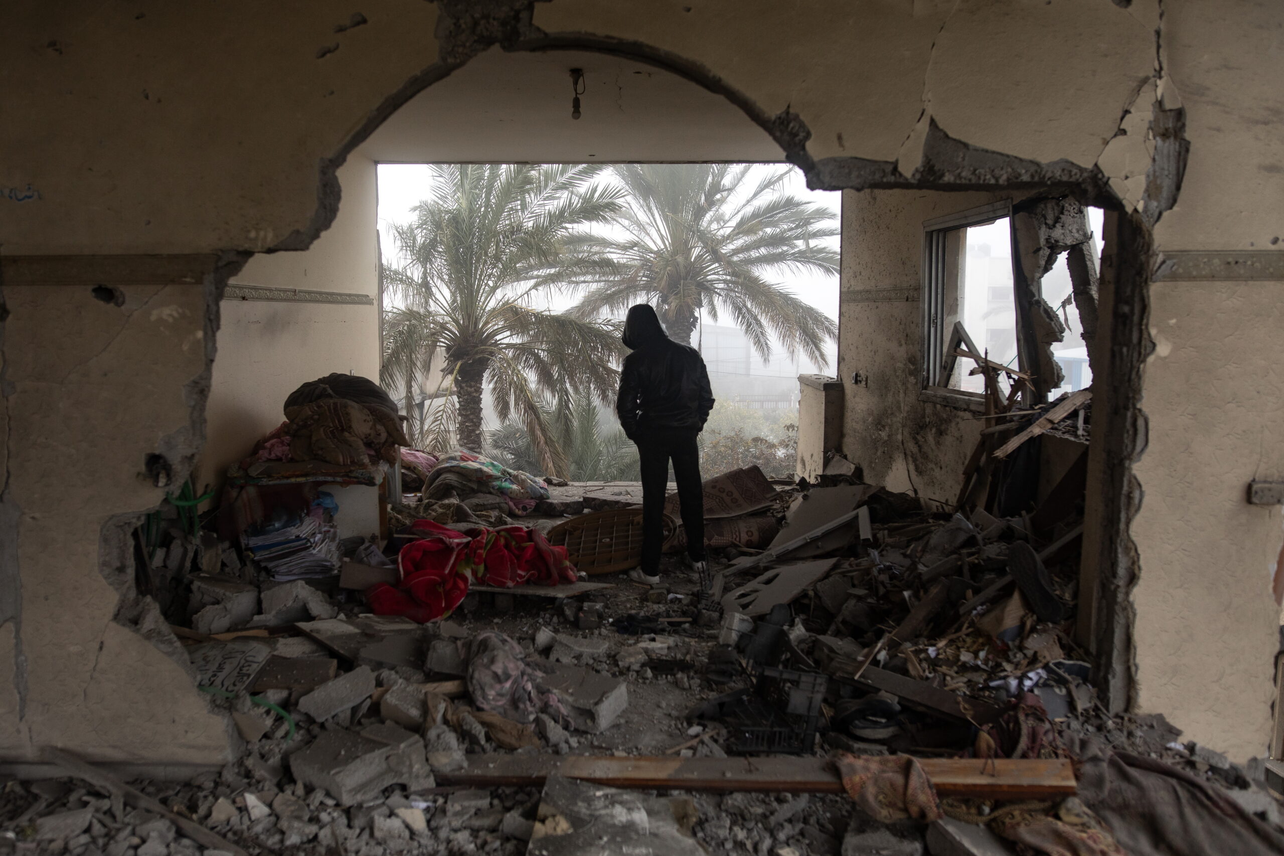 epa11138545 A Palestinian inspects a damaged building following an Israeli airstrike on the Rafah refugee camp, southern Gaza Strip, 09 February 2024. More than 27,500 Palestinians and over 1,300 Israelis have been killed, according to the Palestinian Health Ministry and the Israel Defense Forces (IDF), since Hamas militants launched an attack against Israel from the Gaza Strip on 07 October 2023, and the Israeli operations in Gaza and the West Bank which followed it.  EPA/HAITHAM IMAD