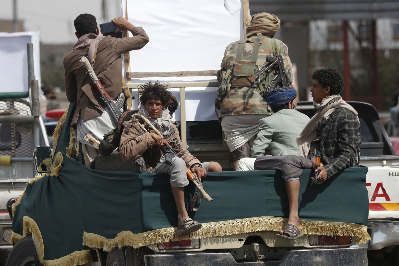 epa11142621 Houthi fighters ride on the back of a pick-up vehicle, in Sana'a, Yemen, 10 February 2024. The US designation of the Houthis as a terrorist group will take effect on 16 February, if the militia does not stop its strikes on ships in the Red Sea and the Gulf of Aden, according to a statement by US ambassador to Yemen Steven Fagin. In January 2024, the US Department of State designated Yemen's Houthis as a 'Specially Designated Global Terrorist group' due to their increased attacks on shipping lanes. In December 2023, the US Department of Defense announced a multinational operation to safeguard trade and protect ships in the Red Sea in response to the escalation of Houthi attacks.  EPA/YAHYA ARHAB