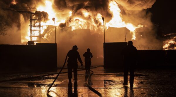 epaselect epa11142862 Firefighters work at the site of a fire after a drone strike on a oil depot in Kharkiv, northeastern Ukraine, 10 February 2024, amid the Russian invasion. At least seven people were killed, including three children, due to a fire after Russian shelling on the Nemyshlyan district of Kharkiv overnight 10 February, the chief of the local administration Oleh Syniehubov wrote on telegram.  EPA/YAKIV LIASHENKO