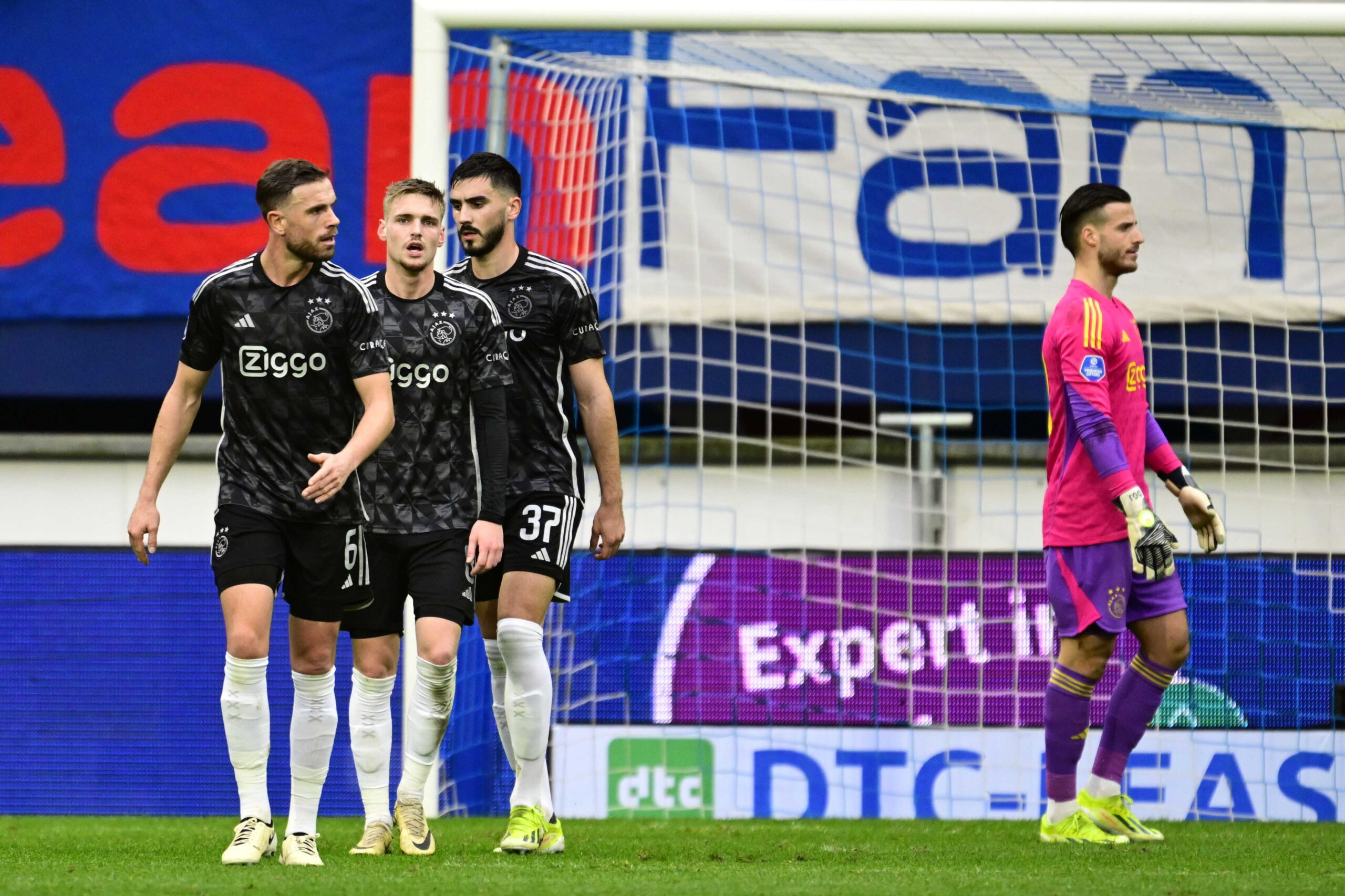 epa11145021 (L-R) Jordan Henderson, Kenneth Taylor, Josip Sutalo, and goalkeeper Diant Ramaj of Ajax walk dejected after they conceded the 2-0 goal during the Dutch Eredivisie soccer match between SC Heerenveen and Ajax Amsterdam in Heerenveen, Netherlands, 11 February 2024.  EPA/Olaf Kraak