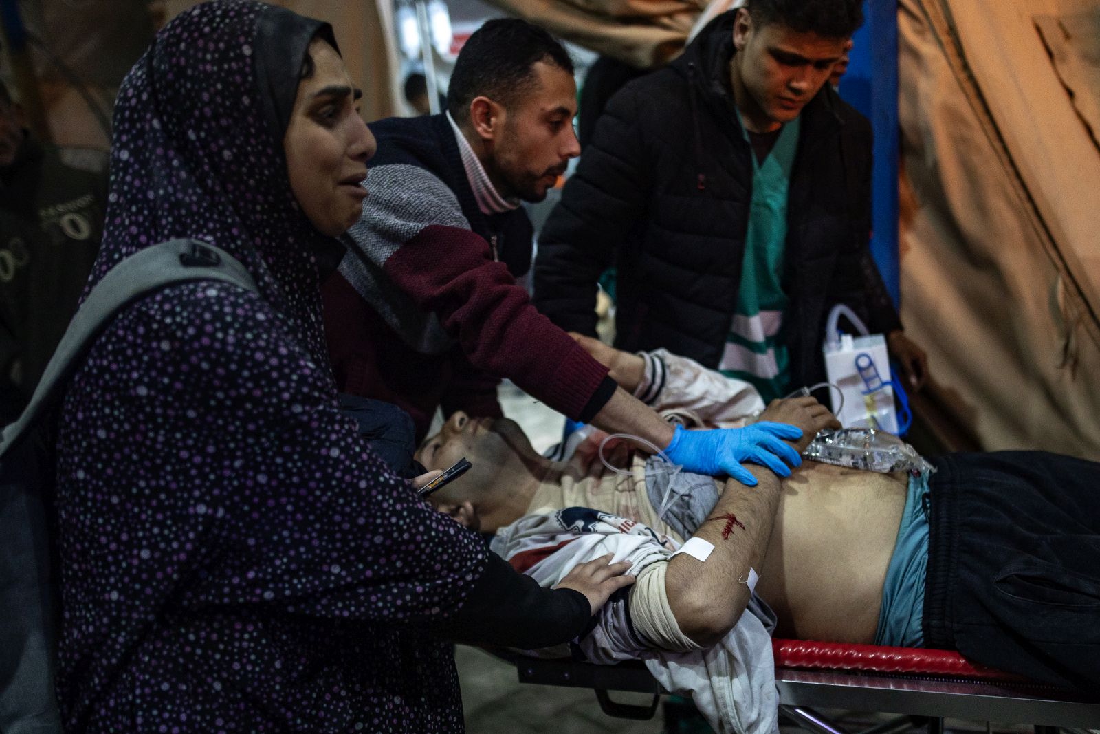 epa11146662 Wounded people are transported to Kuwait Hospital in Rafah, southern Gaza Strip, 12 February 2024, following Israeli air strikes on the Rafah refugee camp in the southern Gaza Strip. According to the Palestinian Health Ministry, 63 people have been killed and more than 230 people have been injured in the airstrikes carried out by the Israeli military. According to a statement released by the Israeli Defense Forces (IDF), two Israeli hostages were rescued during an overnight operation in Rafah. More than 28,000 Palestinians and over 1,300 Israelis have been killed, according to the Palestinian Health Ministry and the Israel Defense Forces (IDF), since Hamas militants launched an attack against Israel from the Gaza Strip on 07 October 2023, and the Israeli operations in Gaza and the West Bank which followed it.  EPA/HAITHAM IMAD ATTENTION EDITORS GRAPHIC CONTENT