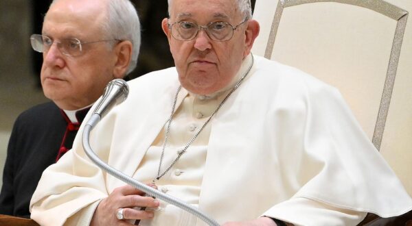 epa11151385 Pope Francis (R) sits next to Italian priest and writer Monsignor Leonardo Sapienza (L), as he leads the the weekly general audience in the Paul VI hall, Vatican City, 14 February 2024.  EPA/ETTORE FERRARI