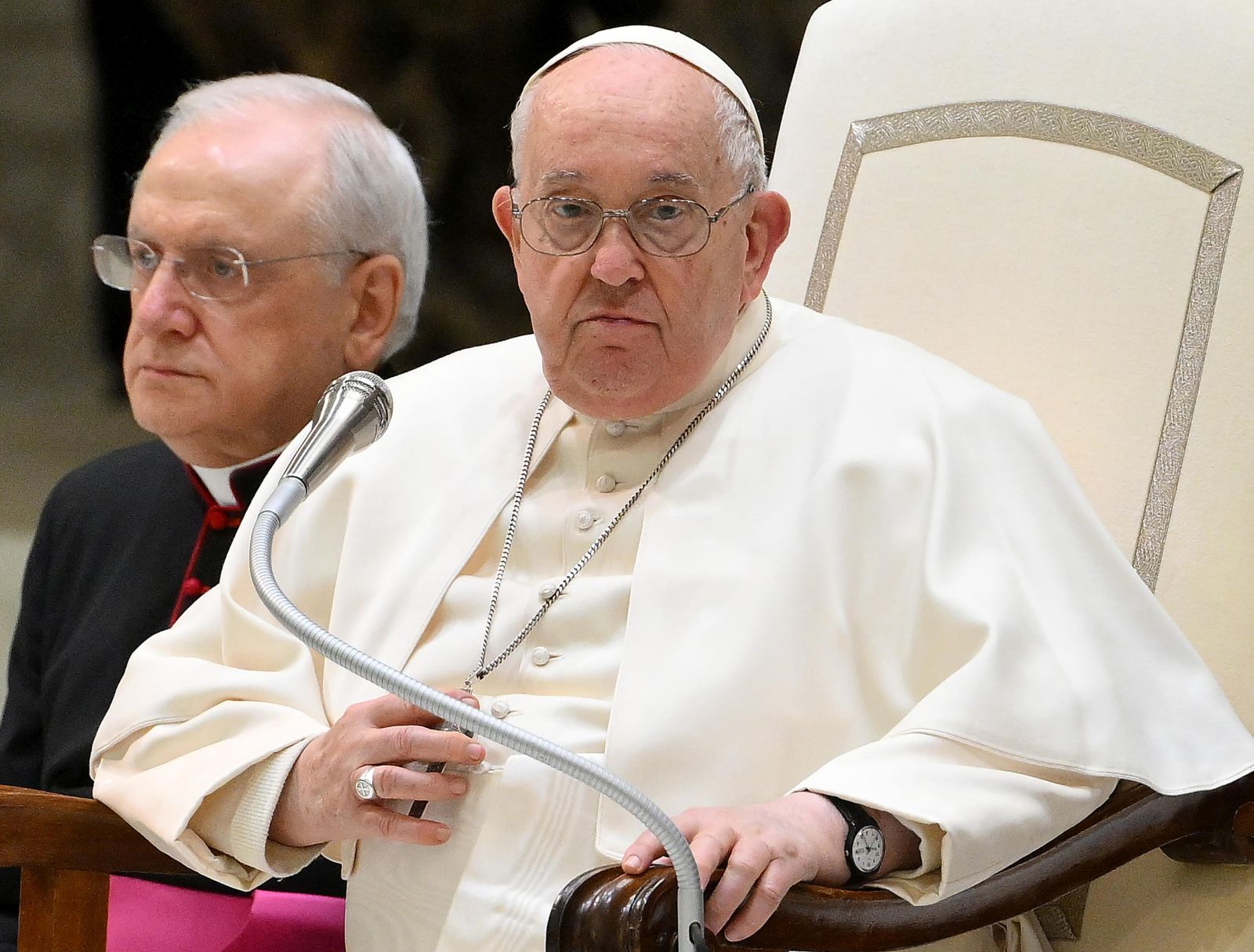 epa11151385 Pope Francis (R) sits next to Italian priest and writer Monsignor Leonardo Sapienza (L), as he leads the the weekly general audience in the Paul VI hall, Vatican City, 14 February 2024.  EPA/ETTORE FERRARI