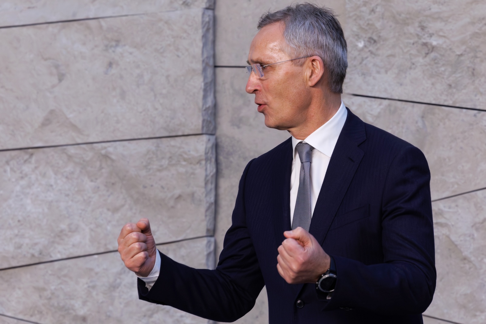 epa11154553 NATO Secretary General Jens Stoltenberg reacts as he arrives for the official photo after a meeting of NATO Ministers of Defence at the Alliance headquarters in Brussels, Belgium, 15 February 2024. NATO defense ministers are meeting at NATO headquarters in Brussels on 15 February to address defense spending, ammunition production and support to Ukraine, among other topics.  EPA/OLIVIER MATTHYS