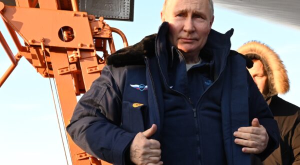epa11172552 Russian President Vladimir Putin answers questions from journalists after a test flight aboard a Tupolev Tu-160 M strategic missile carrier during a visit to the Kazan Aviation Factory named after Sergei Gorbunov, a branch of the Tupolev military industry company, in Kazan, Republic of Tatarstan, Russia, 22 February 2024. Tu-160 (according to NATO codification - Blackjack) is a supersonic strategic missile carrier-bomber with variable sweep wings, developed at the Tupolev Design Bureau in the 1970-1980s. Although serial production of the Tu-160 was discontinued in the 1990s, works are underway in Russia to resume construction of the aircraft in a new look - Tu-160M.  EPA/DMITRIY AZAROV/SPUTNIK/KREMLIN POOL MANDATORY CREDIT