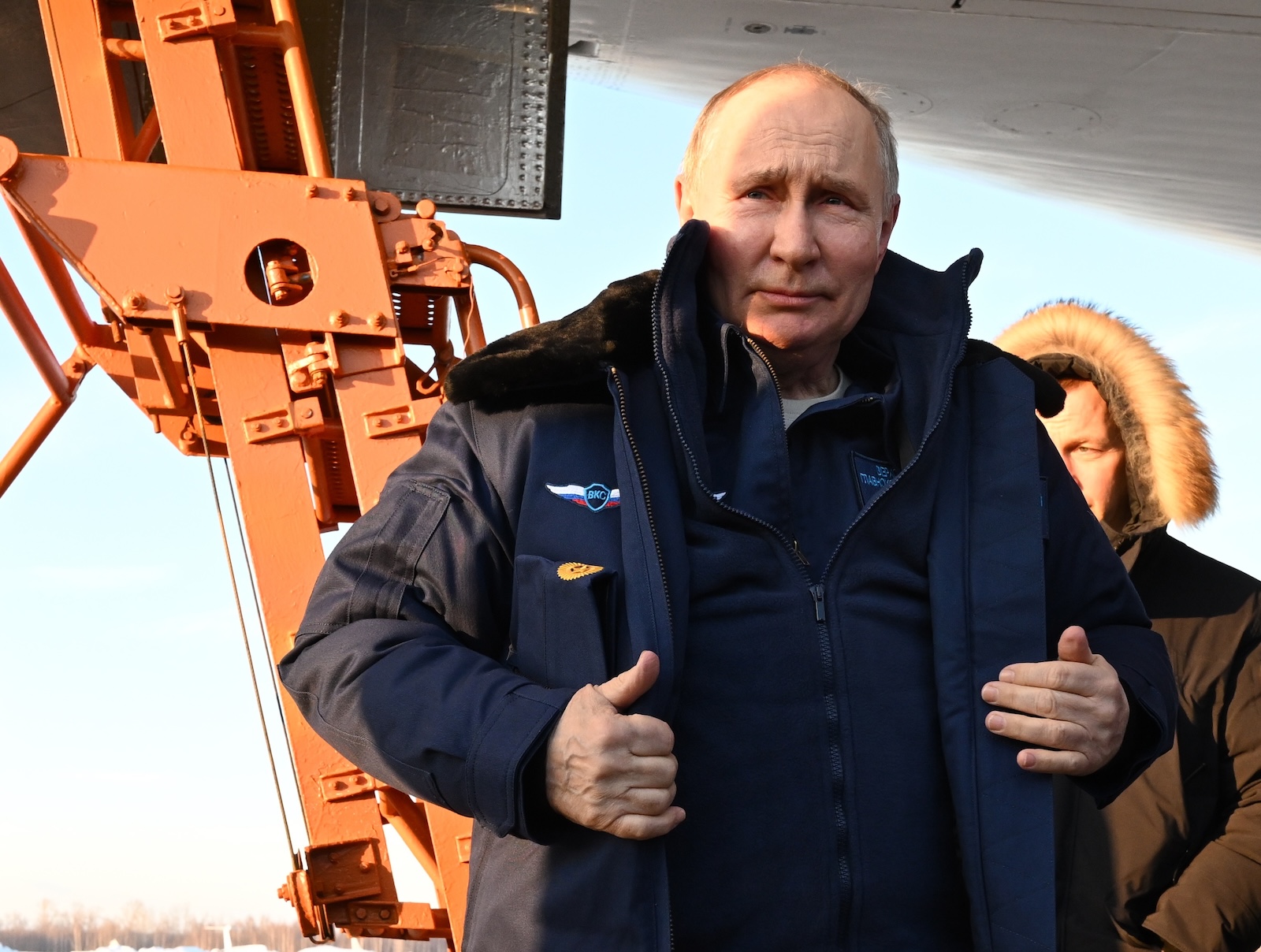 epa11172552 Russian President Vladimir Putin answers questions from journalists after a test flight aboard a Tupolev Tu-160 M strategic missile carrier during a visit to the Kazan Aviation Factory named after Sergei Gorbunov, a branch of the Tupolev military industry company, in Kazan, Republic of Tatarstan, Russia, 22 February 2024. Tu-160 (according to NATO codification - Blackjack) is a supersonic strategic missile carrier-bomber with variable sweep wings, developed at the Tupolev Design Bureau in the 1970-1980s. Although serial production of the Tu-160 was discontinued in the 1990s, works are underway in Russia to resume construction of the aircraft in a new look - Tu-160M.  EPA/DMITRIY AZAROV/SPUTNIK/KREMLIN POOL MANDATORY CREDIT