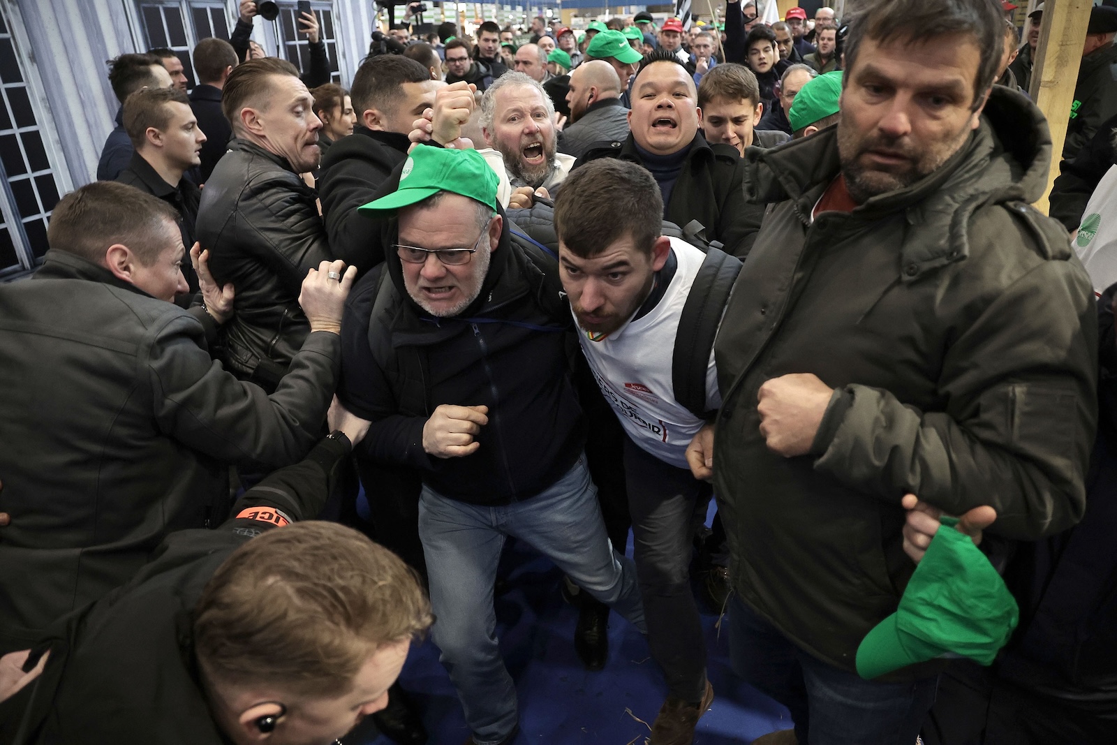 epa11176814 Farmers are stopped while protesting at the opening of the 60th International Agriculture Fair (Salon de l'Agriculture), in Paris, France, 24 February 2024. The 60th edition of the International Agriculture fair will run from 24 February until 03 March 2024 in Paris, amid months of demonstration by farmers all over Europe against the European Union's agricultural policies.  EPA/CHRISTOPHE PETIT TESSON