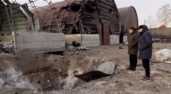 epa11182126 Locals look at a damaged hangar used to store grain after a night rocket attack in Pisochyn, near Kharkiv, northeastern Ukraine, 26 February 2024. amid the Russian invasion. There were no fatalities or injuries, according to the Kharkiv Regional Military Administration. Russian troops entered Ukraine on 24 February 2022 starting a conflict that has provoked destruction and a humanitarian crisis.  EPA/YAKIV LIASHENKO