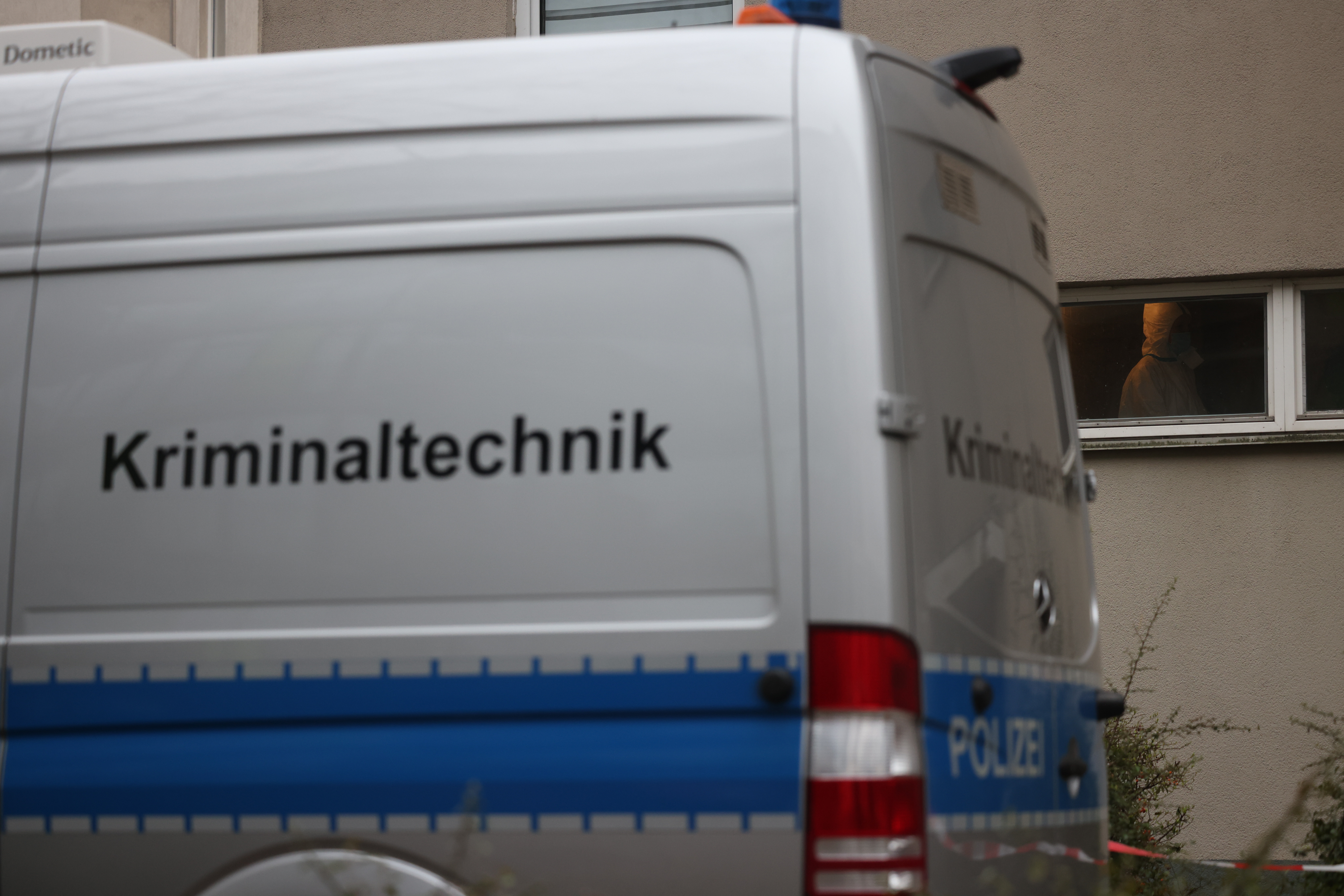 epa11184562 A forensic technology van parks in front of a house where former RAF terrorist Daniela Klette was arrested in Berlin, Germany, 27 February 2024. 65-year-old Daniela Klette was a member of the notorious Red Army Faction (RAF), and after more than 30 years on the run she has now been arrested for armed robbery and attempted murder.  EPA/CLEMENS BILAN