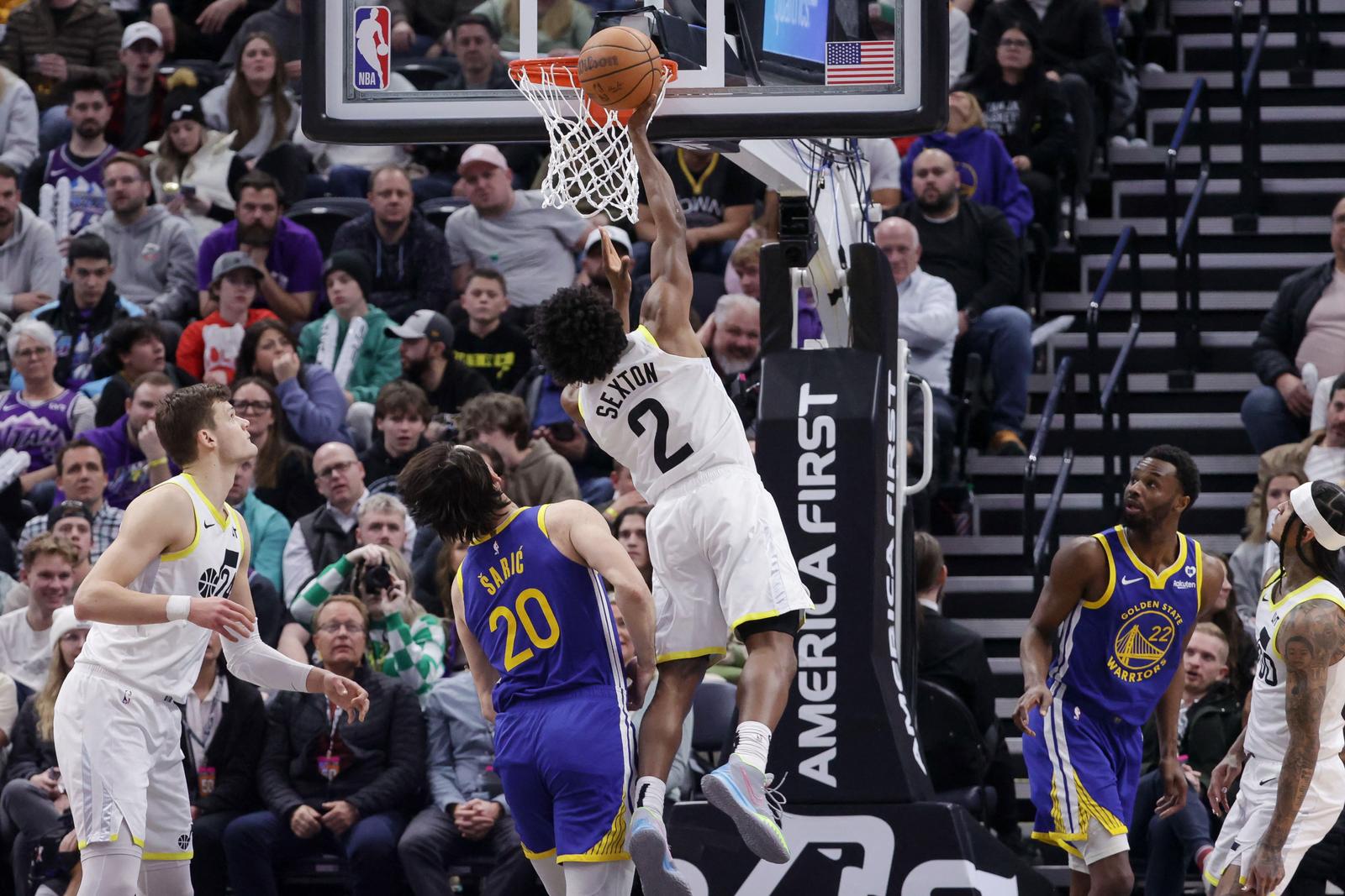 Feb 15, 2024; Salt Lake City, Utah, USA; Utah Jazz guard Collin Sexton (2) shoots over Golden State Warriors forward Dario Saric (20) during the second half at Delta Center. Mandatory Credit: Chris Nicoll-USA TODAY Sports Photo: Chris Nicoll/REUTERS