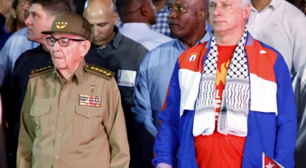 epa11109505 The president of Cuba, Miguel Díaz-Canel (R), and his predecessor, Raul Castro (L), lead the traditional march of the torches to commemorate the 171st anniversary of the birth of the national hero Jose Marti (1853-1895), in Havana, Cuba, 27 January 2024. The traditional night procession, in which several thousand young people participated, started after 8:00 p.m. local time (01:00 GMT, Sunday) on the steps of the University of Havana, in the heart of Havana, between Cuban flags and slogans in favor of the revolution and its leader, former president Fidel Castro.  EPA/Ernesto Mastrascusa