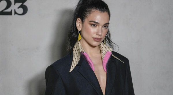 Dua Lipa arrives at the Prada women's Fall-Winter 2023-24 collection presented in Milan, Italy, Thursday, Feb. 23, 2023. (AP Photo/Luca Bruno)