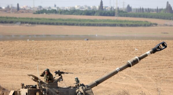 epa10919991 An Israeli soldier next to a machine gun on top of tank turret at an area along the border with Gaza, southern Israel, 15 October 2023. The Israel Defense Force (IDF) on 14 October announced they are increasing readiness and preparing to 'implement a wide range of operational offensive plans', including combined and coordinated strikes by land, sea and air. Israel has called for the evacuation of all civilians of northern Gaza ahead of an expected ground invasion. More than 1,300 Israelis have been killed and over 3,200 others injured, according to the IDF, after the Islamist movement Hamas launched an attack against Israel from the Gaza Strip on 07 October. More than 2,300 Palestinians have been killed and over 9,000 others injured in Gaza since Israel launched retaliatory air strikes, the Palestinian health ministry said.  EPA/ABIR SULTAN