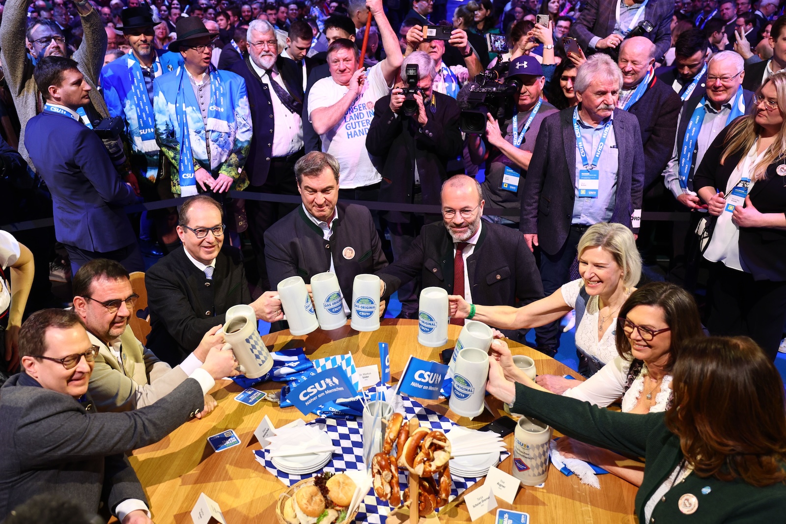 epa11151722 Bavarian Premier Markus Soeder (C) salutes with Member of the German Bundestag Alexander Dobrindt (L) and President of the European Peopleâ€™s Party Manfred Weber (R) at the Political Ash Wednesday gathering of the Christian Social Union (CSU) party in Passau, Germany, 14 February 2024. All major German political parties traditionally hold rallies on Ash Wednesday.  EPA/ANNA SZILAGYI