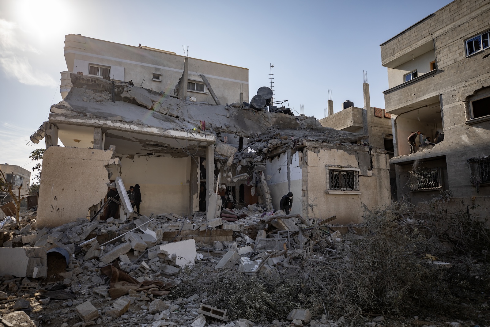 epa11169230 Palestinians inspect the rubble of a house after an Israeli air strike on the Rafah refugee camp, southern Gaza Strip, 21 February 2024. More than 29,100 Palestinians and over 1,300 Israelis have been killed, according to the Palestinian Health Ministry and the Israel Defense Forces (IDF), since Hamas militants launched an attack against Israel from the Gaza Strip on 07 October 2023, and the Israeli operations in Gaza and the West Bank which followed it.  EPA/HAITHAM IMAD
