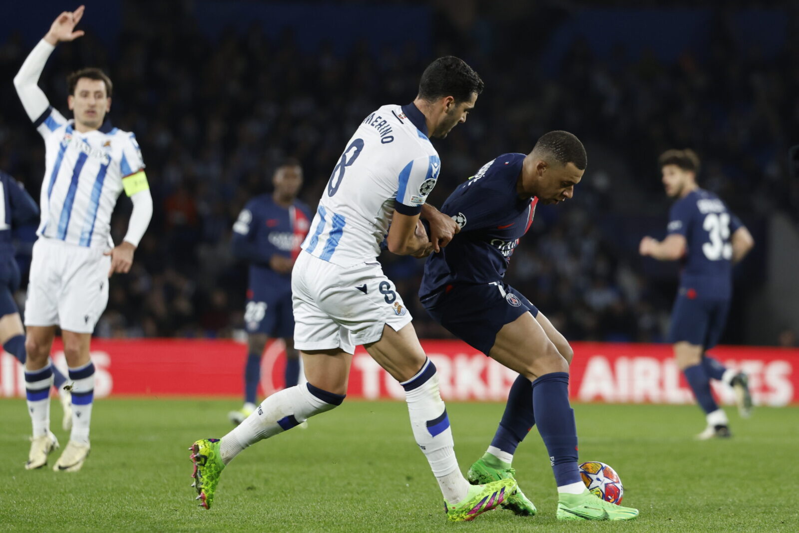 epa11200994 PSG's Kylian Mbape (R) in action against Real Sociedad's Mikel Merino during the UEFA Champions League Round of 16, 2nd leg soccer match between Real Sociedad and Paris Saint-Germain, in San Sebastian, Spain, 05 March 2024.  EPA/Javier Etxezarreta