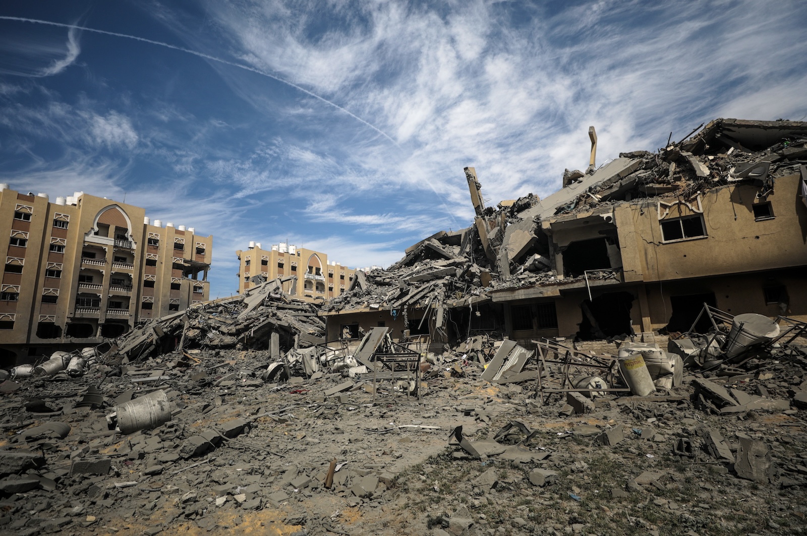 epa11220181 The rubble of the Hamad towers city following an Israeli military operation in Khan Younis town, southern Gaza Strip, 14 March 2024. More than 31,000 Palestinians and over 1,300 Israelis have been killed, according to the Palestinian Health Ministry and the Israel Defense Forces (IDF), since Hamas militants launched an attack against Israel from the Gaza Strip on 07 October 2023, and the Israeli operations in Gaza and the West Bank which followed it.  EPA/MOHAMMED SABER