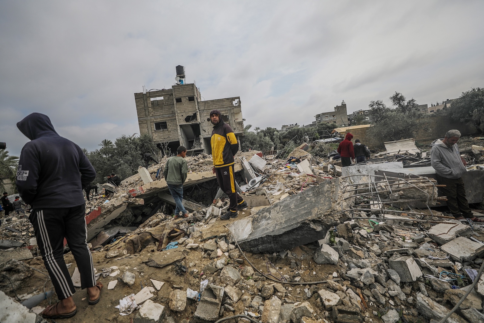 epa11229077 Palestinians search for missing people under the rubble of the destroyed house of the Al Hajj family following an Israeli air strike, in Al Nusairat refugee camp, southern Gaza Strip, 19 March 2024. According to the Palestinian Ministry of Health, more than 10 members of the same family were killed and six remain trapped under the rubble following an overnight Israeli air strike. More than 31,500 Palestinians and over 1,300 Israelis have been killed, according to the Palestinian Health Ministry and the Israel Defense Forces (IDF), since Hamas militants launched an attack against Israel from the Gaza Strip on 07 October 2023, and the Israeli operations in Gaza and the West Bank which followed it.  EPA/MOHAMMED SABER