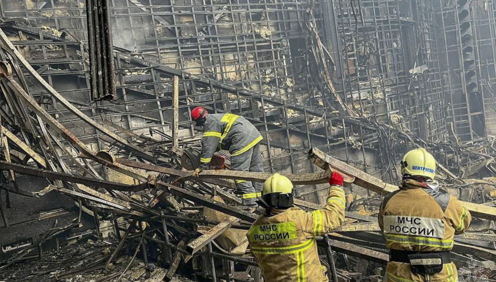 epa11238322 A handout still photo taken from handout video made available by the Russian Emergency Ministry shows rescues examine the debris in the burned hall of the Crocus City Hall concert venue following a terrorist attack in Krasnogorsk, outside Moscow, Russia, 23 March 2024. On 22 March evening, a group of up to five gunmen attacked the Crocus City Hall in the Moscow region, Russian emergency services said. 93 people were killed and more than 100 others were hospitalized, the Investigative Committee confirmed. The head of the Russian FSB, Alexander Bortnikov, reported to Russian President Vladimir Putin on 23 March on the arrest of 11 people, including all four terrorists directly involved in the terrorist attack.  EPA/RUSSIAN EMERGENCIES MINISTRY / HANDOUT BEST QUALITY AVAILABLE  HANDOUT EDITORIAL USE ONLY/NO SALES HANDOUT EDITORIAL USE ONLY/NO SALES