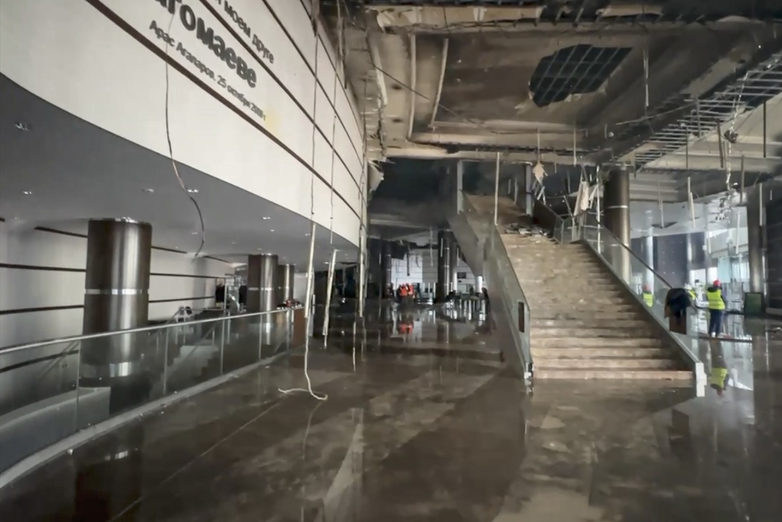 epa11239001 A handout still image taken from handout video provided by the Russian Investigative Committee press-service shows rescuers and investigators working inside the burned Crocus City Hall concert venue following a terrorist attack in Krasnogorsk, outside Moscow, Russia, 23 March 2024. On 22 March, a group of up to five gunmen attacked the Crocus City Hall in the Moscow region, Russian emergency services said. According to the latest data from the Russian Investigative Committee, 133 people died and more than 100 were hospitalized. On the morning of March 23, the director of the Russian FSB, Alexander Bortnikov, reported to Russian President Vladimir Putin about the detention of 11 people, including all four terrorists directly involved in the terrorist attack.  EPA/RUSSIAN INVESTIGATIVE COMMITEE H HANDOUT  HANDOUT EDITORIAL USE ONLY/NO SALES HANDOUT EDITORIAL USE ONLY/NO SALES