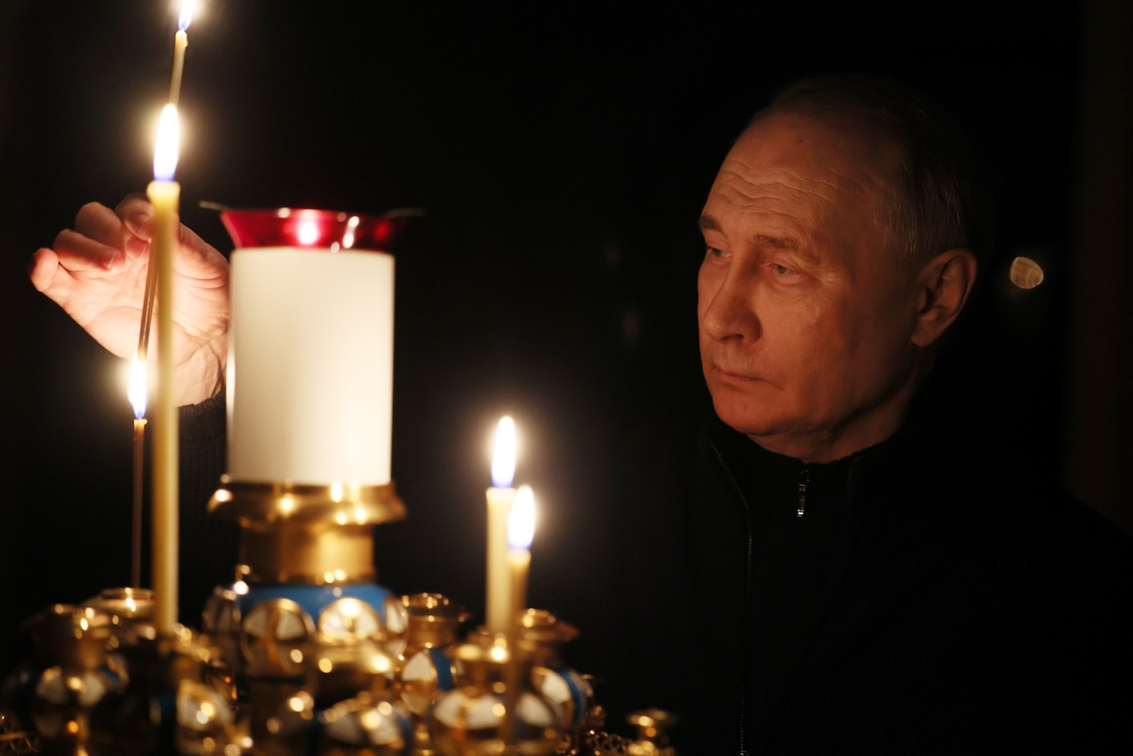 epa11241340 Russian President Vladimir Putin lights a candle to commemorate the victims of a terrorist attack on the Crocus City Hall concert venue on a day of national mourning in Moscow, Russia, 24 March 2024. On 24 March, Russia observed a day of national mourning for the victims of the terrorist attack in Krasnogorsk's Crocus City Hall. At least 152 people were killed and more than 100 hospitalized after a group of gunmen attacked the concert hall in the Moscow region on 22 March evening, according to Russian authorities. Eleven suspects, including all four gunmen directly involved in the terrorist attack, have been detained, Russian officials said.  EPA/MIKHAIL METZEL/SPUTNIK/KREMLIN POOL