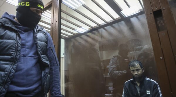 epa11241826 A suspect in the shooting attack on the Crocus City Hall concert venue sits inside a defendant's enclosure during a hearing on pretrial restrictions at Basmanny district court, in Moscow, Russia, 24 March 2024. At least 137 people were killed and more than 180 hospitalized after a group of gunmen attacked the concert hall in the Moscow region on 22 March evening, Russian officials said. Eleven suspects, including all four gunmen directly involved in the terrorist attack, have been detained, according to Russian authorities.  EPA/SERGEI ILNITSKY