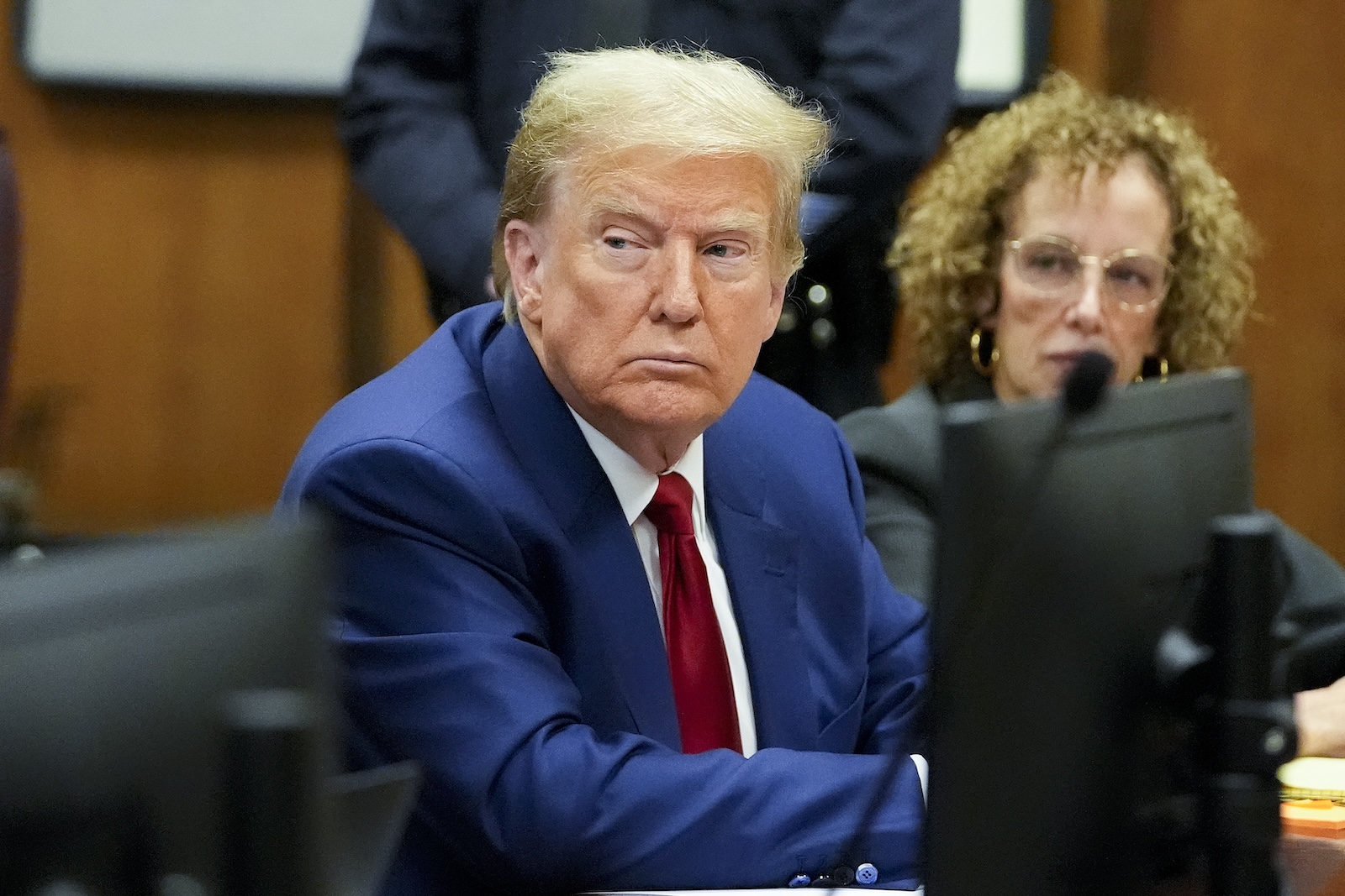 epa11242882 Former US President Donald Trump (L) with his lawyer Susan Necheles (R) awaits the start of a pre-trial hearing with his defense team in Manhattan criminal court in New York City, New York, USA, 25 March 2024. A judge will weigh when the former president will go on trial. Trump is facing 34 felony counts of falsifying business records related to payments made to adult film star Stormy Daniels during his 2016 presidential campaign.  EPA/MARY ALTAFFER / POOL