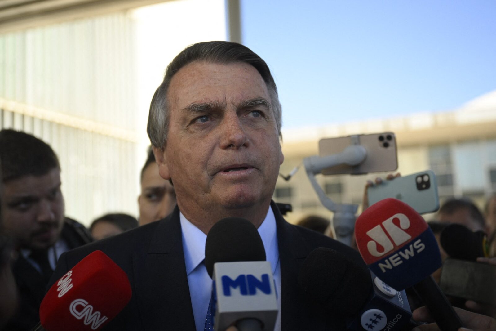 BRASILIA, BRAZIL - JUNE 21: Former Brazilian president Jair Bolsonaro speaks to the press as he leaves the Federal Senate in Brasilia, Brazil on June 21, 2023. Former far-right president Jair Bolsonaro faces a trial starting Thursday that could disqualify him from holding public office for eight years and leave him out of the 2026 Brazilian elections. The Superior Electoral Tribunal (TSE) begins to decide on an open case against the former president (2019-2022) for attacks against the electoral system of electronic ballot boxes during a meeting with diplomats in July 2022, three months before the presidential elections in which he was defeated by the leftist Luiz Inacio Lula da Silva. Mateus Bonomi / Anadolu Agency,Image: 784620084, License: Rights-managed, Restrictions: , Model Release: no, Credit line: Mateus Bonomi / AFP / Profimedia