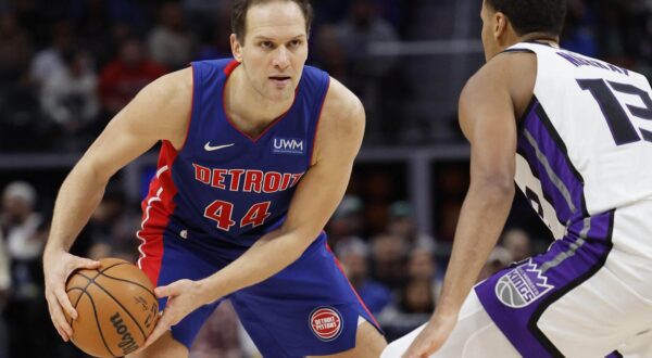 Jan 9, 2024; Detroit, Michigan, USA;  Detroit Pistons forward Bojan Bogdanovic (44) is defended by Sacramento Kings forward Keegan Murray (13) in the second half at Little Caesars Arena. Mandatory Credit: Rick Osentoski-USA TODAY Sports Photo: Rick Osentoski/REUTERS