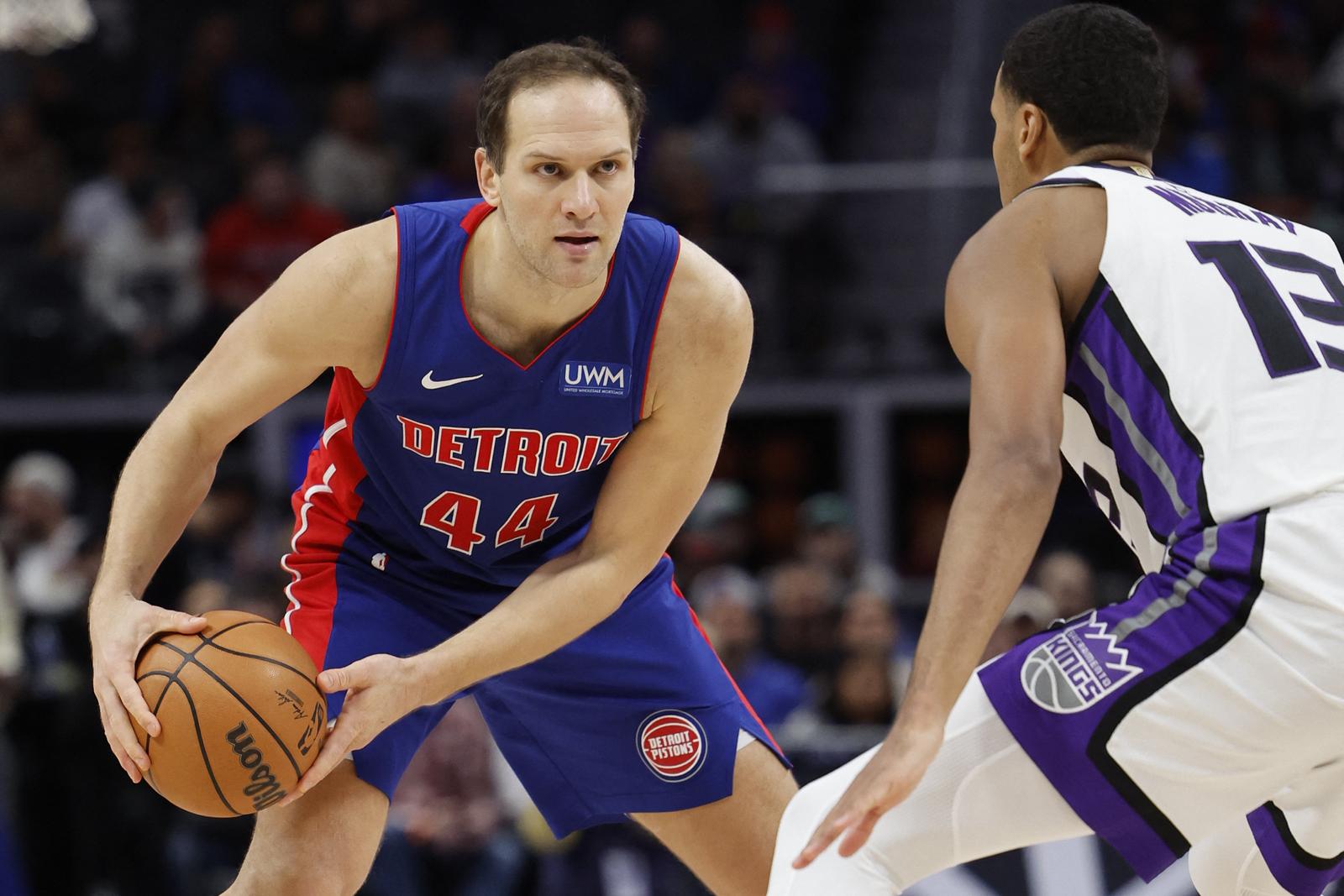 Jan 9, 2024; Detroit, Michigan, USA;  Detroit Pistons forward Bojan Bogdanovic (44) is defended by Sacramento Kings forward Keegan Murray (13) in the second half at Little Caesars Arena. Mandatory Credit: Rick Osentoski-USA TODAY Sports Photo: Rick Osentoski/REUTERS