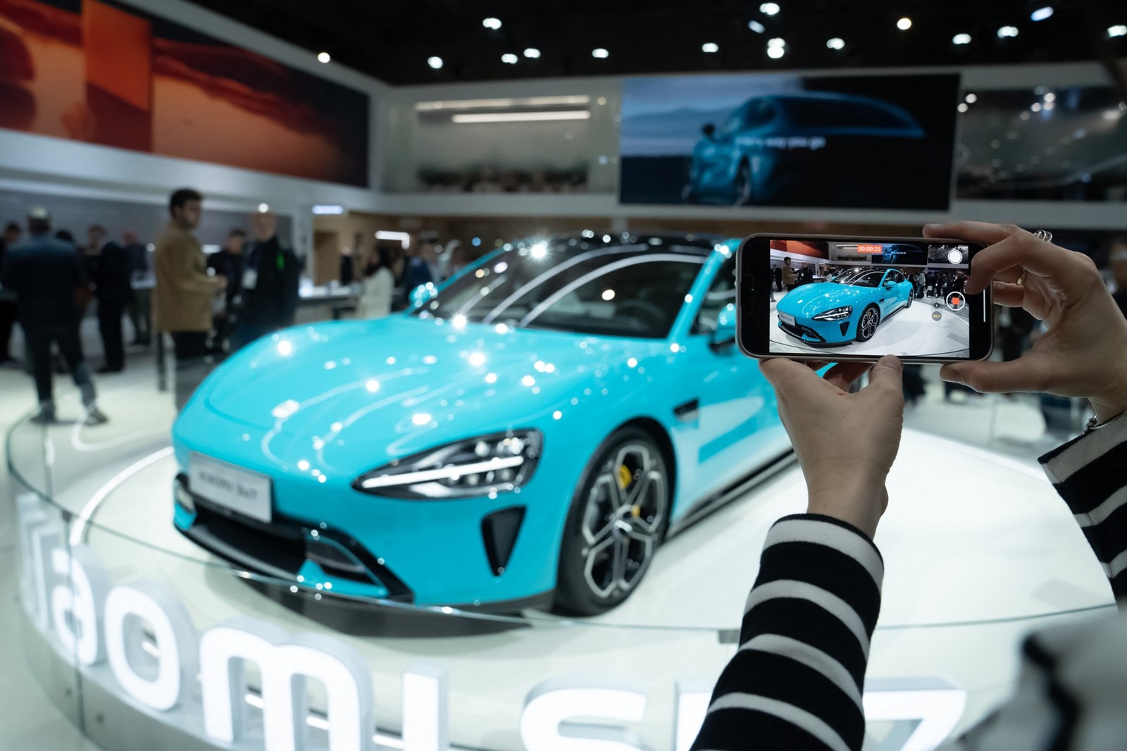 A person with a cell phone during the presentation of the Xiaomi SU7 car, during the second day of the XVIII edition of the Mobile World Congress, at the Fira de Barcelona, on February 27, 2024, in L'Hospitalet de Llobregat, Barcelona, Catalonia (Spain). MWC is the most important mobile technology event in the world and is being held from today until Thursday, February 29, and is expected to bring together some 95,000 attendees, 2,400 exhibitors and 1,100 speakers.
27 Feb 2024
Pictured: A person with a cell phone during the presentation of the Xiaomi SU7 car, during the second day of the XVIII edition of the Mobile World Congress, at the Fira de Barcelona, on February 27, 2024, in L'Hospitalet de Llobregat, Barcelona, Catalonia (Spain). MWC is the most important mobile technology event in the world and is being held from today until Thursday, February 29, and is expected to bring together some 95,000 attendees, 2,400 exhibitors and 1,100 speakers.
27 FEBRUARY 2024
David Zorrakino / Europa Press
02/27/2024.,Image: 851504455, License: Rights-managed, Restrictions: NO Argentina, Aruba, Bolivia, Brazil, Caribbean Netherlands, Chile, Colombia, Curacao, Ecuador, France, French Guiana, Germany, Guyana, Mexico, Paraguay, Peru, Portugal, Spain, Suriname, Trinidad & Tobago, Uruguay, Venezuela, Model Release: no, Credit line: Europa Press / MEGA / The Mega Agency / Profimedia