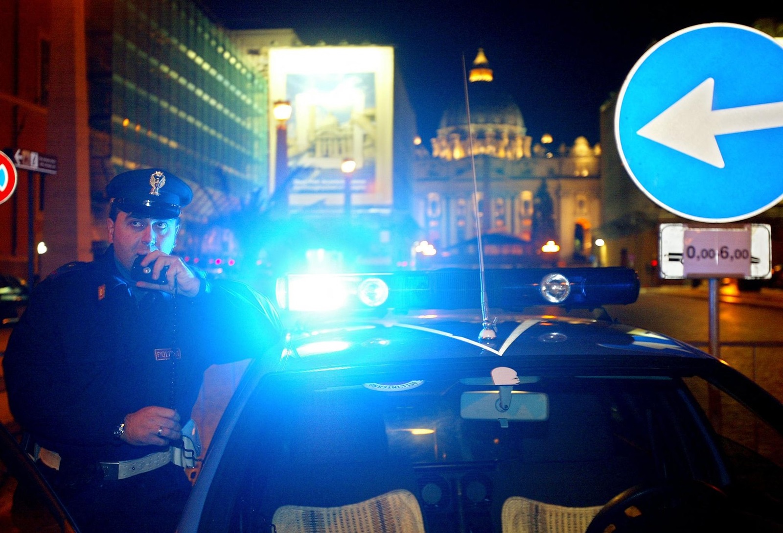 An Italian policeman talks on the radio, 16 December 2003 after closing for the traffic the main avenue leading to the Vatican. Italian police said they were taking the unprecedented measure of closing the main avenue leading to the Vatican every night over Christmas after Israeli intelligence service Mossad passed on a warning about the possibility of attacks on Christian sites. The avenue, Via della Conciliazione, is to be closed from midnight to 7:00 am nightly from Monday.,Image: 72530904, License: Rights-managed, Restrictions: , Model Release: no, Credit line: PATRICK HERTZOG / AFP / Profimedia