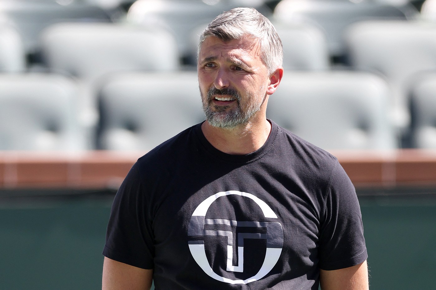 (FILES) - Coach Goran Ivanisevic watches Novak Djokovic of Serbia train in preparation for the BNP Paribas Open at Indian Wells Tennis Garden on March 05, 2024 in Indian Wells, California.   Novak Djokovic and Goran Ivanisevic are to go their separate ways, the tennis world number one announced on March 27, 2024, ending a five-year association which yielded 12 Grand Slams.,Image: 859976802, License: Rights-managed, Restrictions: , Model Release: no, Credit line: MATTHEW STOCKMAN / AFP / Profimedia