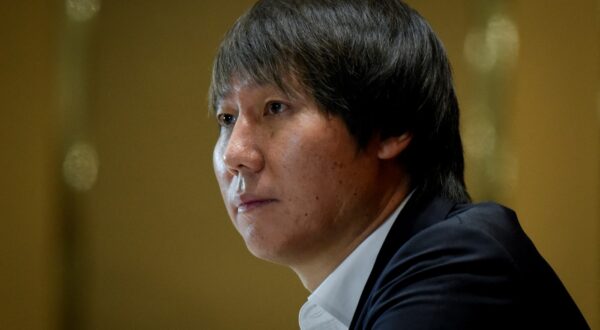 (FILES) Li Tie, the head coach of China men's national football team, attends a press conference in Beijing on January 5, 2020. Former China coach and ex-Everton midfielder Li Tie went on trial on March 28, 2024 on allegations of bribery, state media said, part of a broader crackdown on corruption in football in the country.,Image: 860255386, License: Rights-managed, Restrictions: , Model Release: no, Credit line: WANG Zhao / AFP / Profimedia
