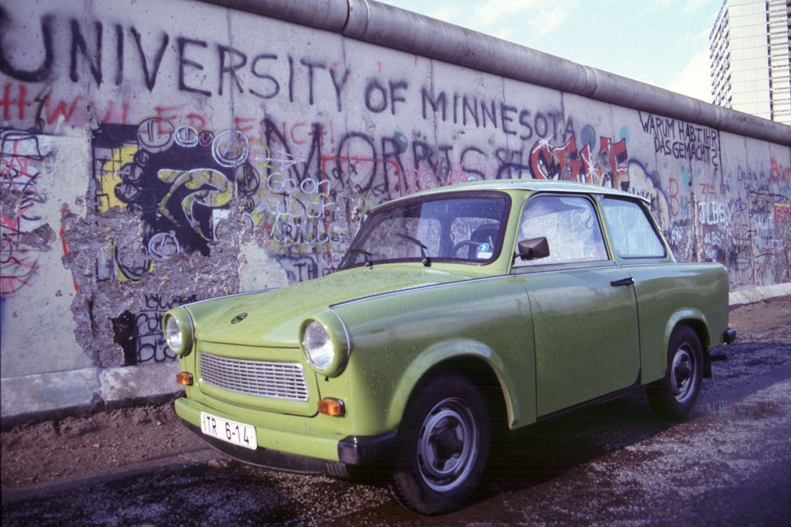 Germany - March 6, 2024.The Trabant GDR cult car turns 60..Germany, Berlin - 1990  .TRABANT car  next to the Wall,Image: 854292283, License: Rights-managed, Restrictions: * France, Germany and Italy Rights Out *, Model Release: no, Credit line: Antonio Pisacreta / Zuma Press / Profimedia
