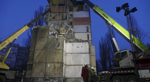 epa11197128 Ukrainian rescuers continue to clean debris on the site of a damaged residential building after a Russian drone attack one day eralier, in the southern city of Odesa, Ukraine, 03 March 2024.  By 03 March, twelve people are known to have died, including three children and eight others were injured, following the  drone attack of 02 March, according to the Ukraine's State Emergency Service report. Russian troops entered Ukraine in February 2022 starting a conflict that has provoked destruction and a humanitarian crisis.  EPA/IGOR TKACHENKO