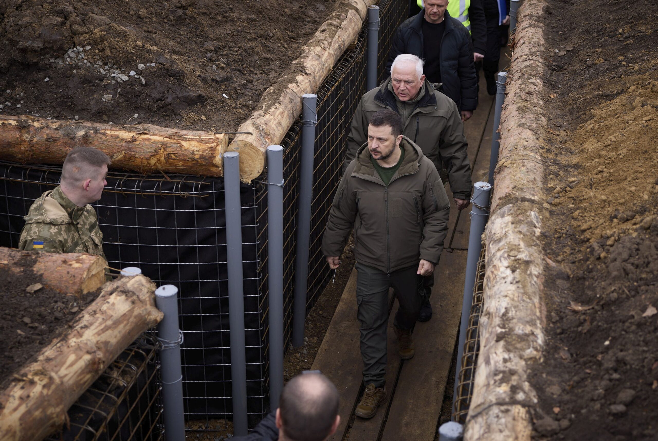 epa11247120 A handout picture made available by the Presidential Press Service shows Ukrainian President Volodymyr Zelensky (C) visiting the 117th Seperate Territorial Defence Brigade during a working visit to the Sumy region, Ukraine, 27 March 2024 amid the Russian invasion. Zelenskyy was briefed on the organization across three lines of defense and discussed the current needs for weapons and equipment. Russian troops entered Ukrainian territory on 24 February 2022, starting a conflict that has provoked destruction and a humanitarian crisis.  EPA/PRESIDENTIAL PRESS SERVICE HANDOUT   HANDOUT EDITORIAL USE ONLY/NO SALES HANDOUT EDITORIAL USE ONLY/NO SALES