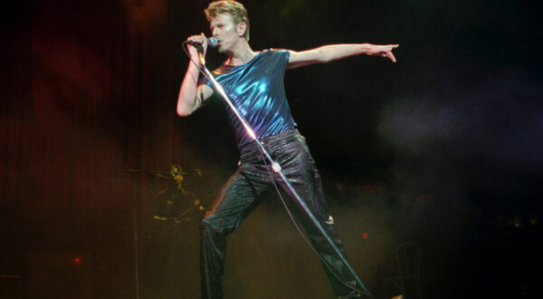 CORRECTS DATE OF DEATH TO SUNDAY, JAN. 10, 2016 - FILE - In this Sept. 14, 1995, file photo, David Bowie performs in Hartford, Conn. Bowie, the innovative and iconic singer whose illustrious career lasted five decades, died Sunday, Jan. 10, 2016, after battling cancer for 18 months. He was 69. (AP Photo/Bob Child, File)