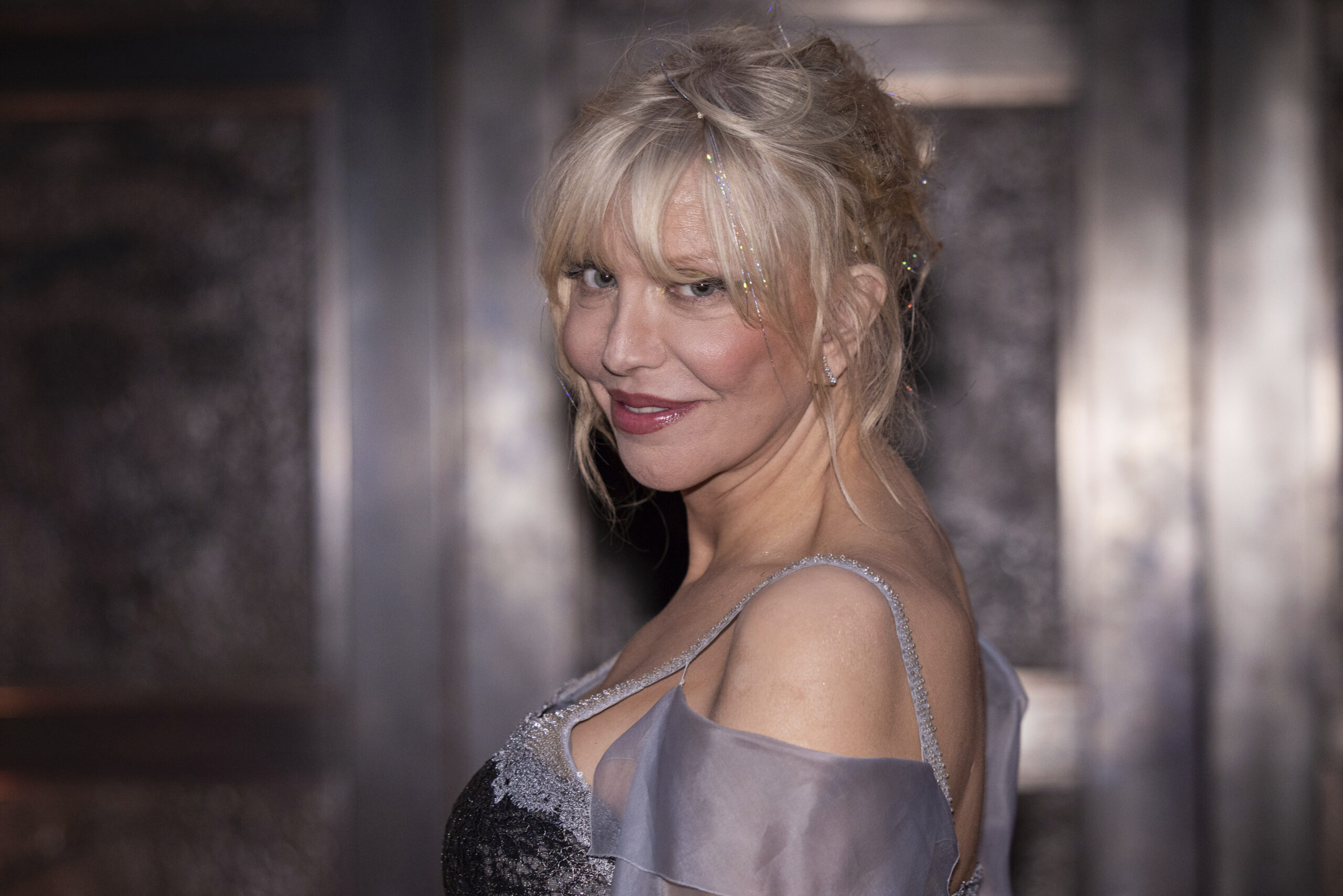 Courtney Love poses for photographers upon arrival at the National Portrait Gallery Re-Opening on Tuesday, June 20, 2023 in London. (Vianney Le Caer/Invision/AP)