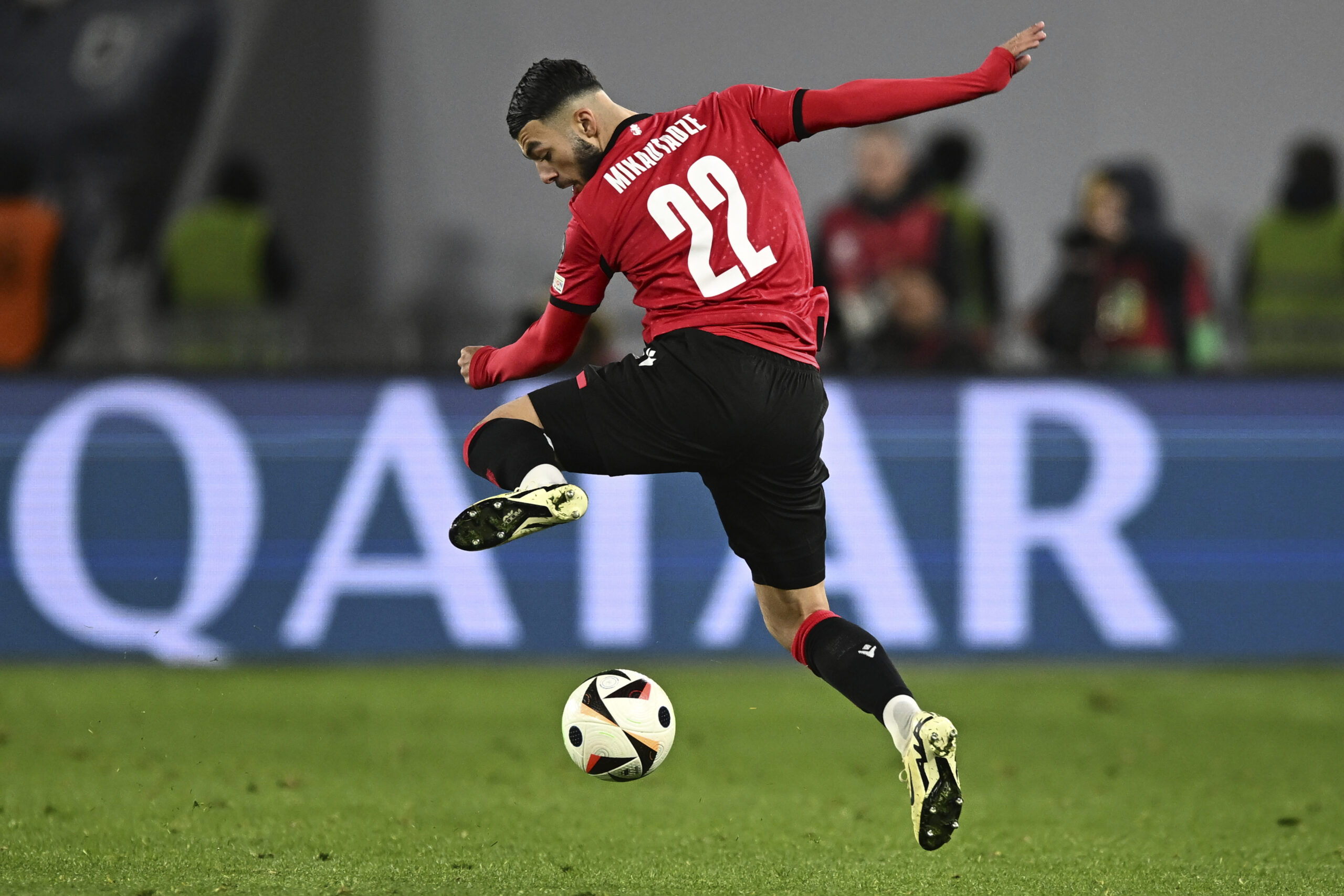 Georgia's Georges Mikautadze controls the ball during the Euro 2024 qualifying play-off soccer match between Georgia and Greece at the Boris Paichadze National Stadium in Tbilisi, Georgia, Tuesday, March 26, 2024. (AP Photo/Tamuna Kulumbegashvili)
