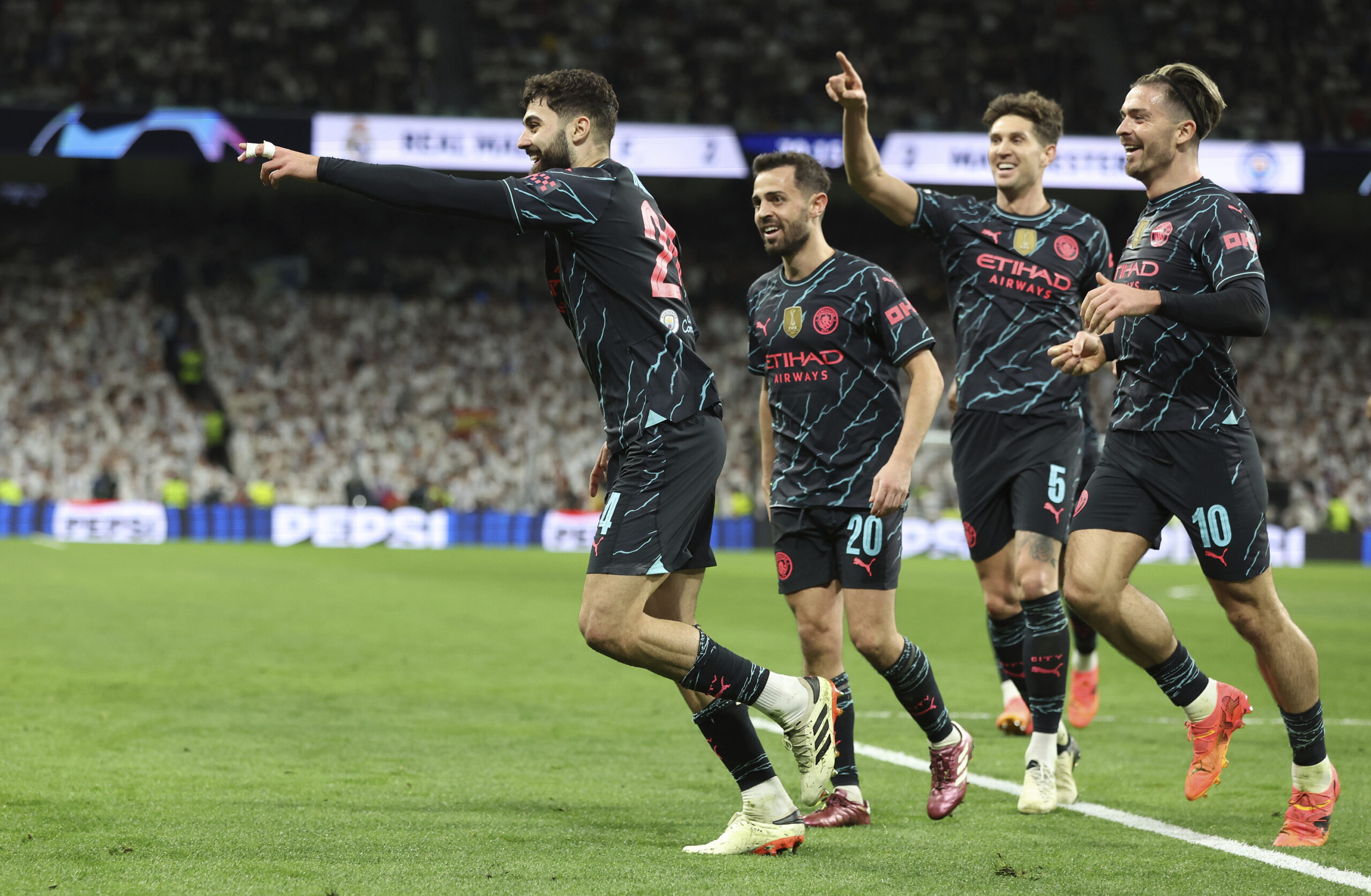 April 9, 2024, Madrid: Madrid, Spain, 9th April 2024. JoÅ¡ko Gvardiol of Manchester City (L) celebrates after scoring his teams third goal during the UEFA Champions League match at the Santiago Bernabau, Madrid. (Credit Image: Â© Paul Terry/Sportimage/Cal Sport Media) (Cal Sport Media via AP Images)