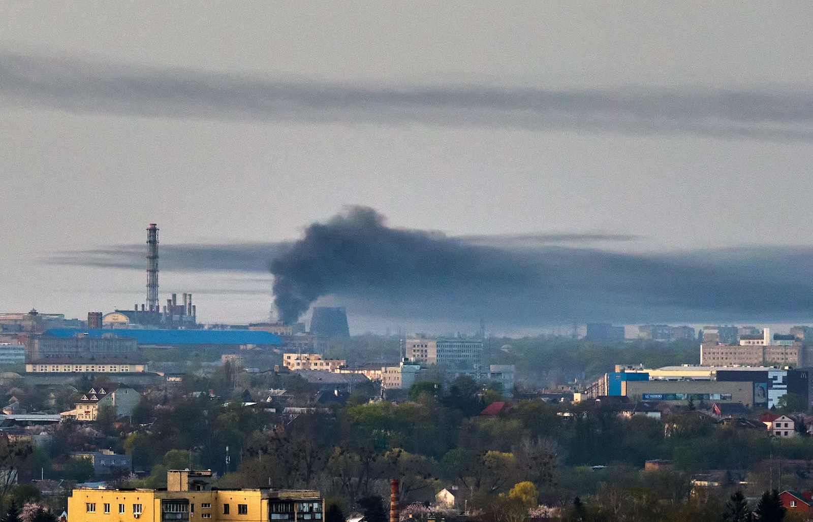 epa11271839 A cloud of smoke rises above a site following a rocket attack in Kharkiv, northeastern Ukraine, 11 April 2024, amid the Russian invasion. According to the Air Force Command of the Armed Forces of Ukraine, some 42 Russian rockets of different classes and 40 shock drones where launched on Kharkiv early 11 April 2024, with 18 rockets and 39 shock drones among them intercepted.  Russian troops entered Ukrainian territory on 24 February 2022, starting a conflict that has provoked destruction and a humanitarian crisis.  EPA/SERGEY KOZLOV