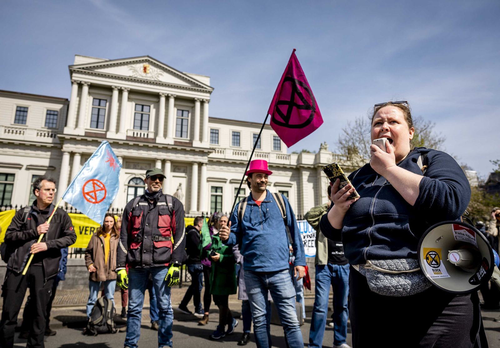 epa11274760 Activists from Extinction Rebellion and Kappen met Coal take part in a road blockade in front of the provincial government building in Haarlem, the Netherlands, 12 April 2024. Activists are demanding that the regional government revoke the permits for Tata Steel's Cooking Gas Plants 1 and 2.  EPA/REMKO DE WAAL