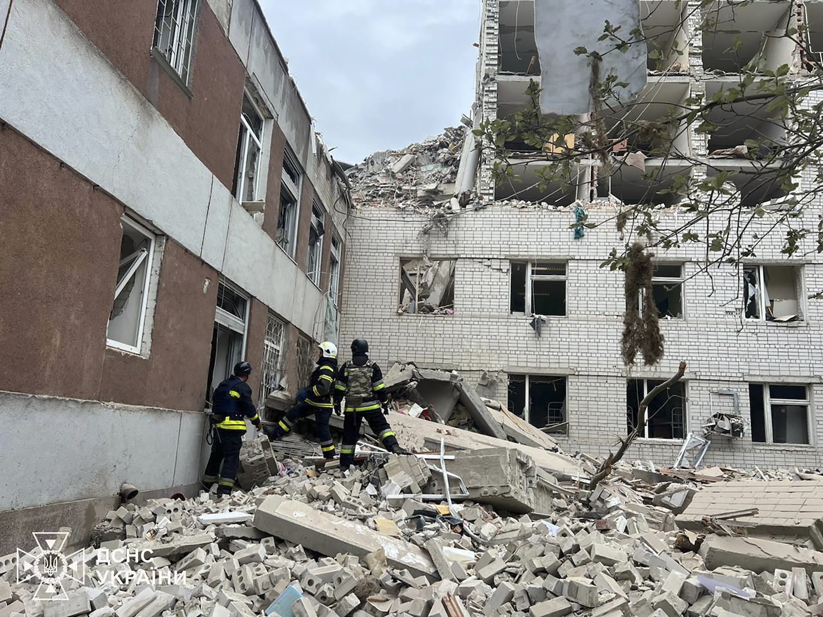 epa11283804 A handout picture made available by the State Emergency Service of Ukraine shows rescuers working at the site of a rocket strike in the city of Chernihiv, Ukraine, 17 April 2024, amid the Russian invasion. At least 11 people were killed and more than 20 others were injured, according to the State Emergency Service. A social infrastructure facility, a hospital, and several residential high-rise buildings were damaged as a result of the morning rocket attack in Chernihiv, north of Kyiv.  EPA/STATE EMERGENCY SERVICE HANDOUT   HANDOUT EDITORIAL USE ONLY/NO SALES HANDOUT EDITORIAL USE ONLY/NO SALES
