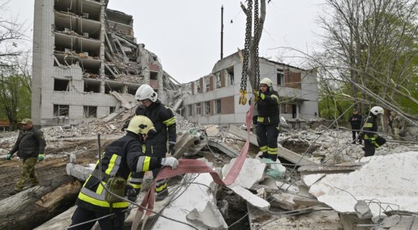 epa11284581 Ukrainian rescuers work at the site of a missile strike in Chernihiv, northern Ukraine, 17 April 2024, amid the Russian invasion. At least 17 people were killed and 60 others injured, including three children, following a Russian missile strike in Chernihiv, the State Emergency Service of Ukraine (SESU) said, adding that a search and rescue operation was ongoing. A social infrastructure facility, a hospital, and several residential high-rise buildings were damaged as a result of the morning rocket attack in Chernihiv, north of Kyiv, Ukrainian officials said.  EPA/SERHII OLEXANDROV